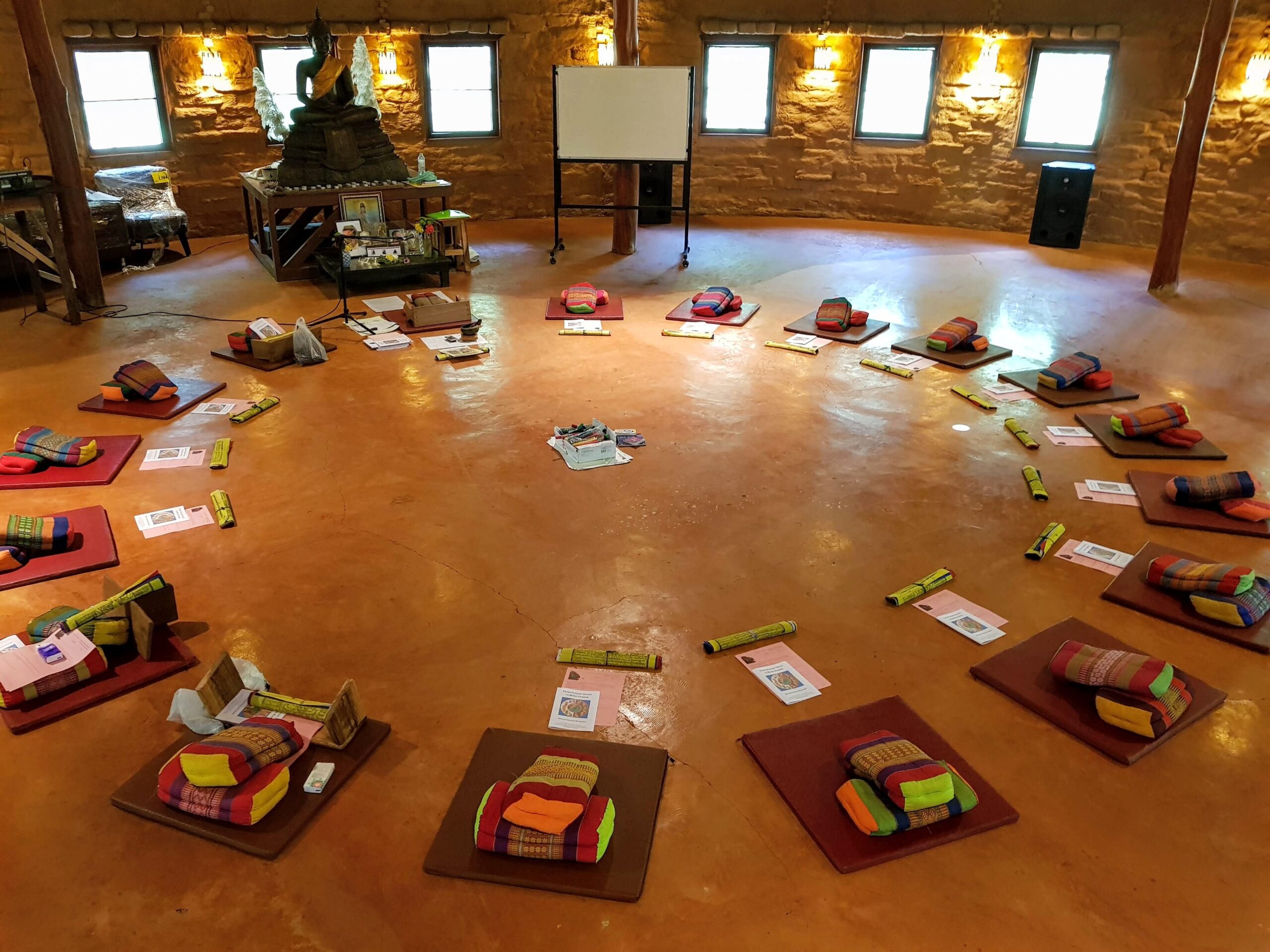 Meditation Hall set out with mats and cushions.